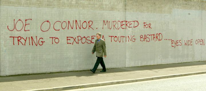 Graffitti off a side street off the Falls Road, Belfast, relating to Real IRA man Joe O'Connor who was shot dead in 2000, taken in 2003 after "Stakeknife" was allegedly unmasked.