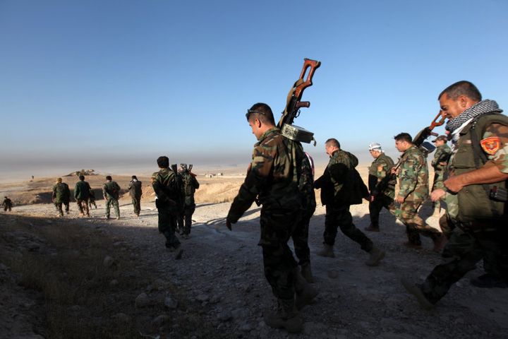 Peshmerga forces walk in the east of Mosul during operation to attack Islamic State militants in Mosul, Iraq, October 17, 2016.