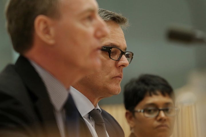 Kerry Purcell (centre), managing director of IBM Australia, with colleagues Michael Shallcross and Permenthri Pillay during the hearing on Tuesday