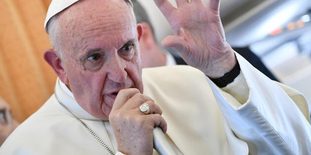 Pope Francis speaks to journalists on his flight back to Rome, Italy Nov. 1.