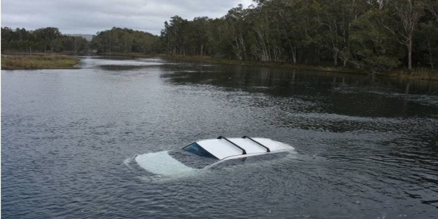 A man accidentally crashed into Lake Cathie on the NSW Mid North Coast after a fright from a spider.