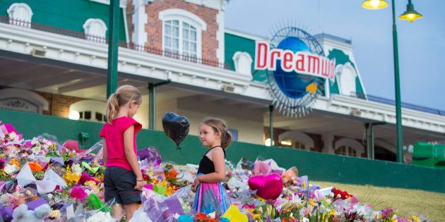 Community members paid tribute to the four dead at Dreamworld.