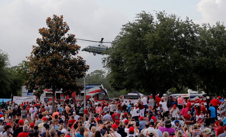 Trump supporters cheer as the president's helicopter lands in Panama City Beach, Florida on May 8, 2019. 