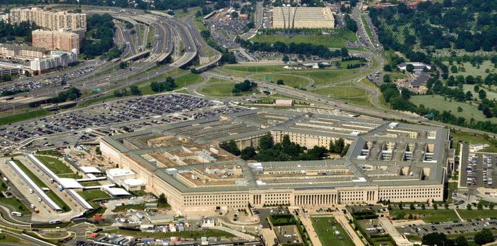 Aerial of the Pentagon, the Department of Defense headquarters in Arlington, Virginia, near Washington DC, with I-395 freeway on the left, and the Air Force Memorial up middle.