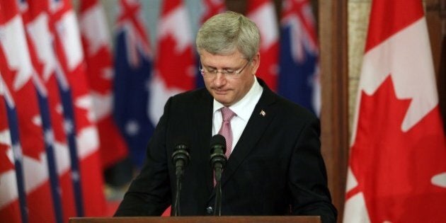 Canadian Prime Minister Stephen Harper pauses as he address the media alongside Australian Prime Minister Tony Abbott(not shown) on Parliament Hill in Ottawa, Canda, June 9, 2014. AFP PHOTO/ Cole BURSTON (Photo credit should read Cole Burston/AFP/Getty Images)