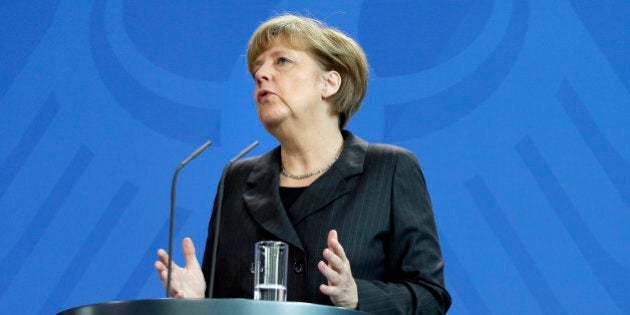 German Chancellor Angela Merkel addresses the media during a joint news conference after a meeting with the Prime Minister of Iraq, Haider al-Abadi, at the chancellery in Berlin, Germany, Friday, Feb. 6, 2015. (AP Photo/Michael Sohn)