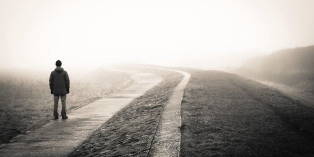 lonely man loosing the way on a foggy day.