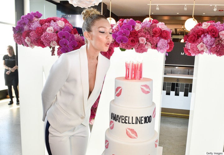 Gigi Hadid Stuns In White Pantsuit At Maybelline 100 Party In Toronto
