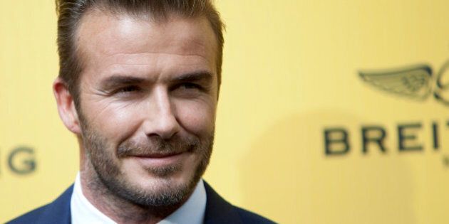 English former footballer David Beckham poses for photographers during a photocall in Madrid, Spain on Wednesday, June 3, 2015. (AP Photo/Abraham Caro Marin)