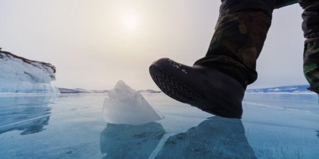 Frozen Lake Baikal and human leg