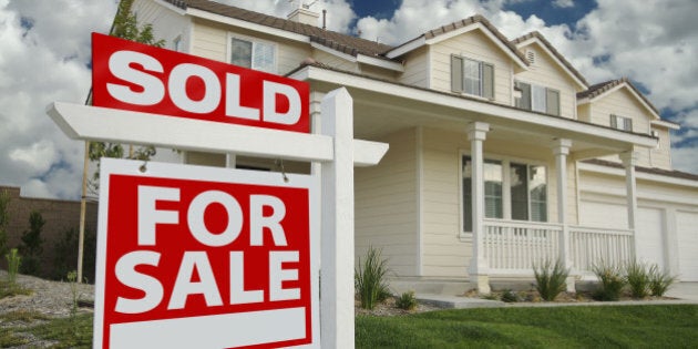 Sold Home For Sale Sign in Front of Beautiful New Home