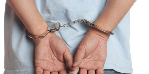 man hands in handcuffs