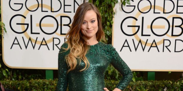 Olivia Wilde arrives at the 71st annual Golden Globe Awards at the Beverly Hilton Hotel on Sunday, Jan. 12, 2014, in Beverly Hills, Calif. (Photo by Jordan Strauss/Invision/AP)