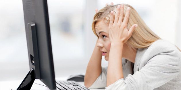 picture of stressed businesswoman with computer at work
