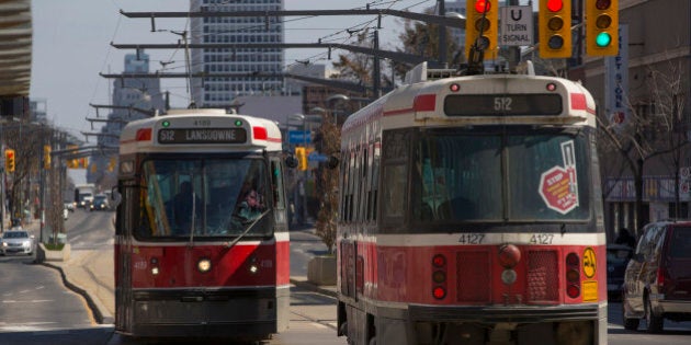 TORONTO, ON - APRIL 2: Lansdowne 512 streetcars pass each other at Wychwood Ave and St. Clair Avenue. TTC stats suggest that the St. Clair right of way for streetcars has improved ridership and cut transit trip times. April 2, 2014. (Chris So/Toronto Star via Getty Images)