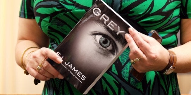 British author E.L. James poses with a copy of her new book 'Grey: Fifty Shades of Grey as Told by Christian' at the Barnes and Noble store on Fifth Avenue in New York on June 18, 2015. The 'Fifty Shades' trilogy is a record-breaking contemporary publishing phenomenon, selling more than 125 million copies worldwide and translated into more than 50 languages. AFP PHOTO/JEWEL SAMAD (Photo credit should read JEWEL SAMAD/AFP/Getty Images)