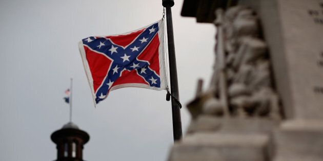 COLUMBIA, SC - JUNE 23: The Confederate flag flies on the Capitol grounds one day after South Carolina Gov. Nikki Haley announced that she will call for the Confederate flag to be removed on June 23, 2015 in Columbia, South Carolina. Debate over the flag flying at the Capitol was again ignited off after nine people were shot and killed during a prayer meeting at the Emanuel African Methodist Episcopal Church in Charleston, South Carolina. (Photo by Win McNamee/Getty Images)