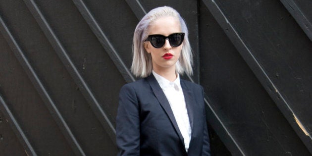 LONDON, ENGLAND - JUNE 15: Fashion blogger Lucy Anderson wears Kooples suit, Topshop sunglasses, H and M shoes, Zara shirt and Louis Vuitton bag on day 4 of London Collections: Men on June 15, 2015 in London, England. (Photo by Kirstin Sinclair/Getty Images)