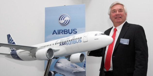 BERLIN, GERMANY - SEPTEMBER 11: John Leahy, chief commercial officer of Airbus, poses with a model of an Airbus A320 airplane during the company's press conference at the 2012 Internationale Luftausstellung (ILA) Air Show on September 11, 2012 in Berlin, Germany. The Toulouse-based company, the largest maker of commercial aircraft, raised its 20-year forecast for deliveries last week, expecting strong orders in Asia-Pacific markets, predicting USD 3.9 trillion, or about 28,200 airplanes, in sales. (Photo by Adam Berry/Getty Images)