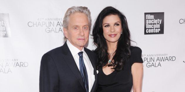 NEW YORK, NY - APRIL 22: Michael Douglas (L) and Catherine Zeta Jones attend the 40th Anniversary Chaplin Award Gala at Avery Fisher Hall at Lincoln Center for the Performing Arts on April 22, 2013 in New York City. (Photo by Jamie McCarthy/Getty Images)