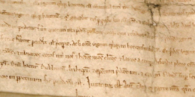 A detail of a copy of the Magna Carta, one of the pivotal documents of Western civilization, rests in a display case at Boston's Museum of Fine Arts, Monday, June 30, 2014. One of only four surviving copies of the original 1215 document, it is on loan from the Lincoln Cathedral in the United Kingdom. (AP Photo/Steven Senne)