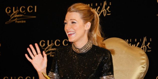 DUBAI, UNITED ARAB EMIRATES - JANUARY 03: Blake Lively attends a photocall and meets 'Gucci Premiere' competition winners at Galeries Lafayette, Dubai Mall on January 3, 2014 in Dubai, United Arab Emirates. (Photo by Haider Yousuf/Getty Images)