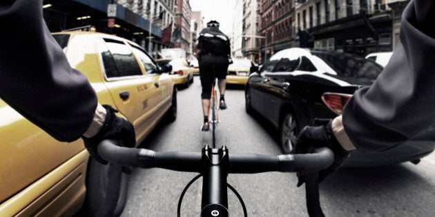 The handlebar view of a bike courier in New York City.