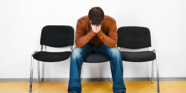 stressed man in a waiting room