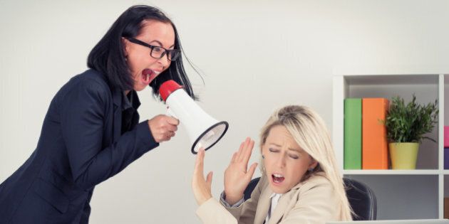 Mad boss yelling at employee on megaphone
