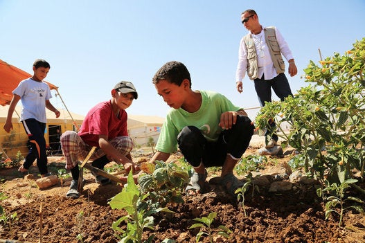 Mohammad Abu Farah teaches the children at a Save the Children youth centre in Za’atari Camp