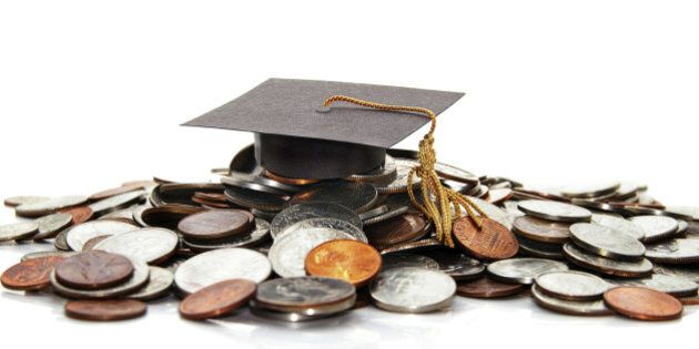 graduation cap on a pile of money ( student debt )