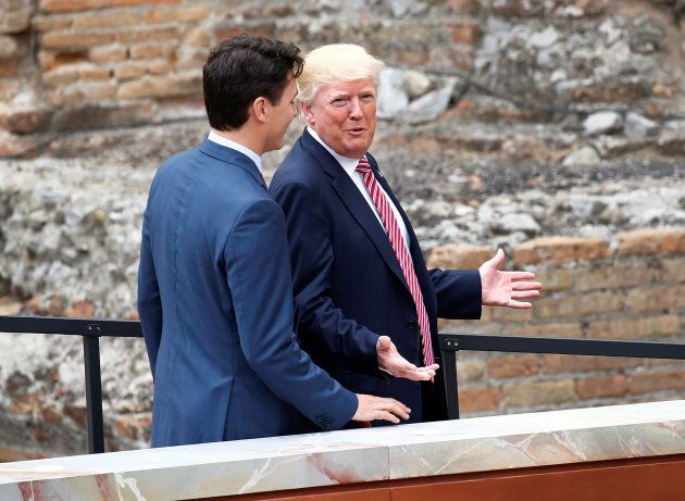 U.S. President Donald Trump and Prime Minister Justin Trudeau talk during the G7 summit in Taormina, Sicily, Italy, May 26, 2017.