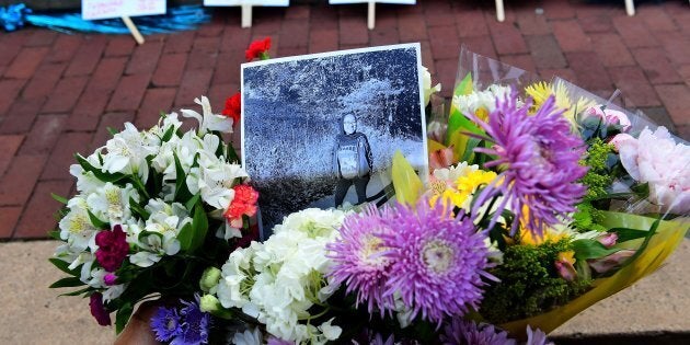 Friends, family, neighbors and strangers bring flowers to a vigil for Nabra Hassanen at Lake Anne Plaza June 21, 2017 near Reston, VA. Hassanen was killed by a 22-year-old while walking near her mosque.(Photo by Katherine Frey/The Washington Post via Getty Images)