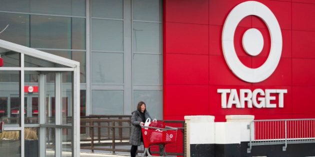 Shopper Laura Steele pushes a shopping cart as she leaves a Target Corp. store in Toronto, Ontario, Canada, on Thursday, Jan. 15, 2015. Target Corp. will walk away from Canada less than two years after opening stores there, putting an end to a mismanaged expansion that racked up billions in losses. Photographer: Kevin Van Paassen/Bloomberg via Getty Images