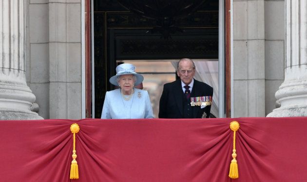 Queen Elizabeth ll and Prince Philip, Duke of Edinburgh look out from the balcony of Buckingham Palace during the annual Trooping the Colour parade on June 17, 2017 in London, England.