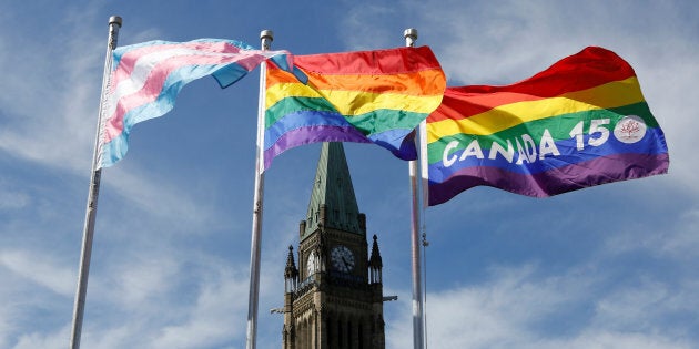 The transgender pride, pride and Canada 150 pride flags fly following a flag raising ceremony on Parliament Hill in Ottawa, Ontario, Canada on June 14, 2017.