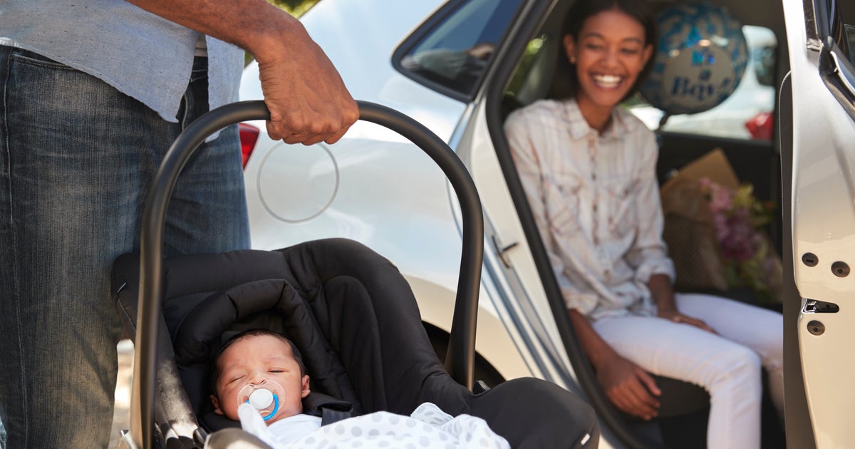 Chiropractor Shows Parents How To Properly Carry A Baby Car Seat