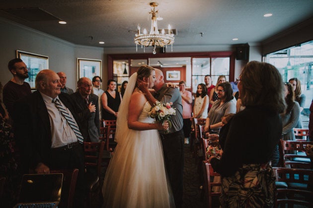 Father of the bride, Eric, giving away his daughter.