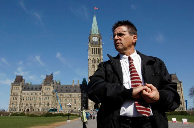 Ottawa professor Hassan Diab leaves the Parliament Hill following a news conference in Ottawa April 13, 2012.