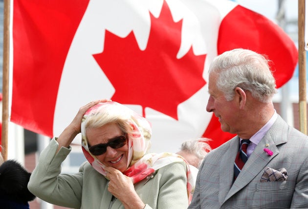 Britain's and Camilla, Duchess of Cornwall, reacts to the wind while sitting next to Prince Charles during an official welcome ceremony at the Nunavut Legislative Assembly in Iqaluit, Nunavut, Canada, June 29, 2017. REUTERS/Chris Wattie