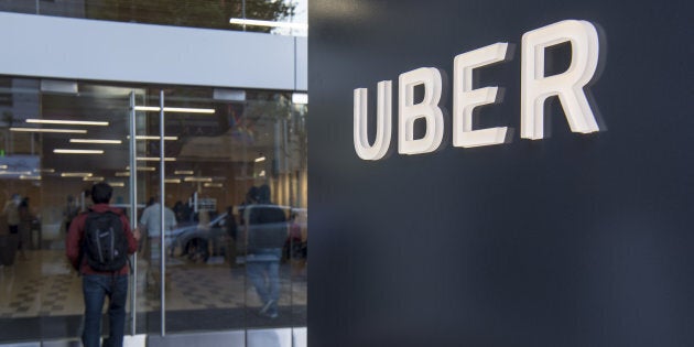 A man enters the Uber Technologies Inc. headquarters building in San Francisco, California, U.S., on Wednesday, June 21, 2017.