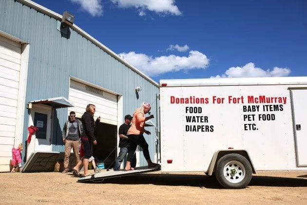 A truck with donations arrives at Wandering River, Alta. after raging forest fires forced more than 80,000 from their homes in Fort McMurray.