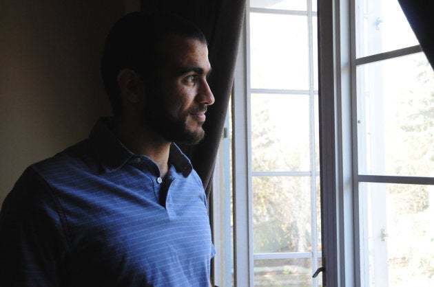 Omar Khadr looks out the window of his home on May 9, 2015, two days after being freed after having spent nearly half of his life in custody.