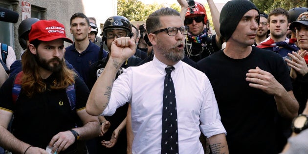 In this April 27, 2017 file photo, Gavin McInnes, centre, founder of the far-right group Proud Boys, is surrounded by supporters after speaking at a rally in Berkeley, Calif.