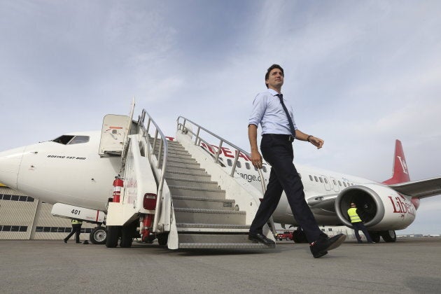 Liberal leader Justin Trudeau steps off his campaign plane in Calgary, Alta. on Oct. 18, 2015.