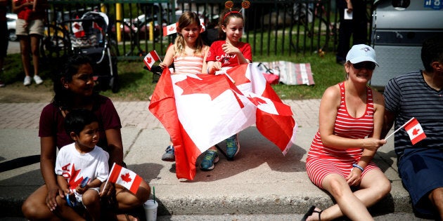 People watch the East York Toronto Canada Day parade, as the country marks its 150th anniversary with