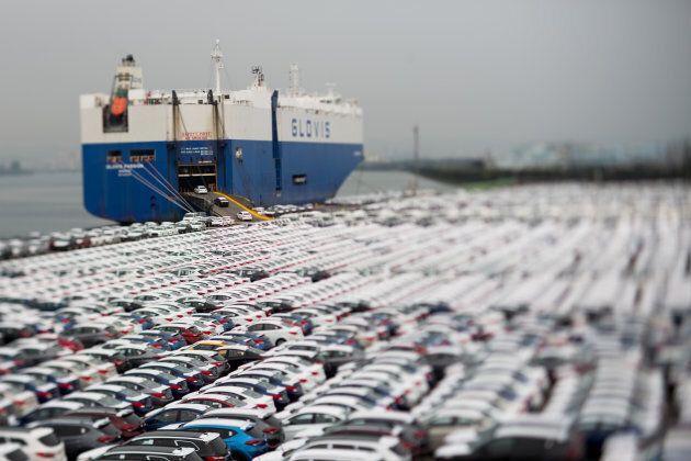 Hyundai Motor Co. vehicles bound for export are driven into a Hyundai Glovis Co. roll-on/roll-off (RORO) cargo ship at a port near Hyundai Motor's Ulsan plant.