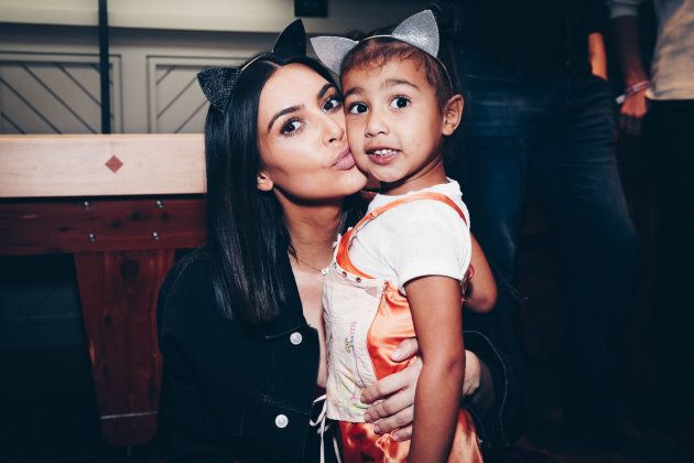 Kim Kardashian and daughter North West attend Ariana Grande's Dangerous Woman Concert Inglewood, California. (Photo by Rich Fury/Forum Photos via Getty Images)