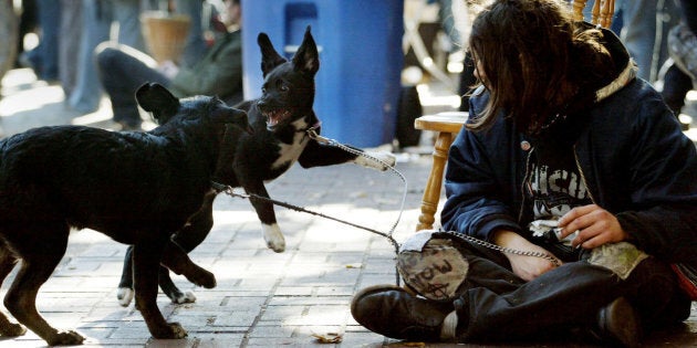 A squatter camped outside a empty building in Vancouver's downtown eastside, Oct. 30, 2002. Vancouver, along with Toronto, Calgary and Montreal, accounts for most of the increase in income inequality in Canada in recent years, a new study has found.