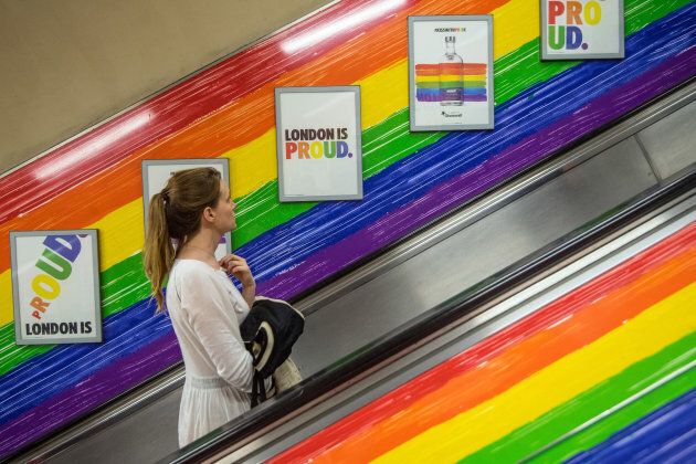 A woman rides a tube escalator decorated with the Pride flag colours on July 5, 2017 in London, England. The annual Pride Festival takes place in London fromJune 24 to July 9 2017 and includes the Pride in London parade on July 8. (Photo by Carl Court/Getty Images)